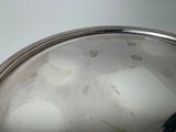 a metal pan with eggs in it on a table