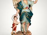 an image of a statue of an angel holding a child