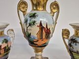 three vases that are sitting on a table