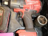 a tool in a box with a hammer and a wrench