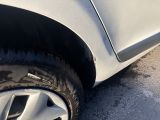 a close up of a car ' s tire on the road