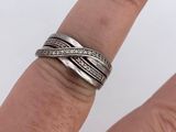 a woman ' s hand with a ring on it ' s finger