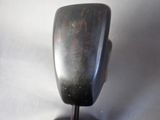 a black sculpture on a black stand on a white background