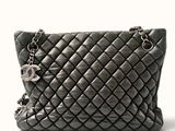 an image of a black purse on a white background