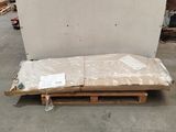 a large piece of cardboard sitting on a pallet in a warehouse
