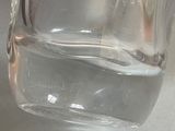 a close up of a glass of water with a toothbrush in it