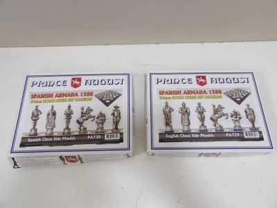 two boxes of plastic figurines are sitting on a table