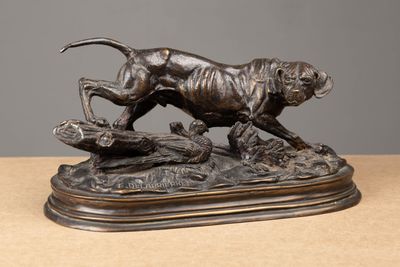 an image of a bronze statue of a tiger on a log
