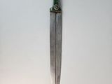 a knife hanging on the wall in the room