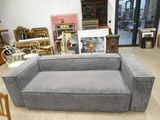 a couch that is sitting in the middle of a room
