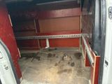 a white van that is parked in a garage