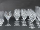 a lot of wine glasses that are sitting on a table
