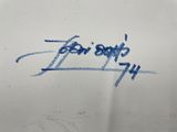 graffiti written on the side of a white truck with blue writing on it