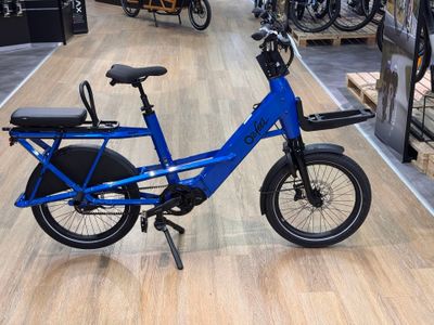a blue bike that is on display in a store