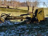 a tractor that is sitting in the snow