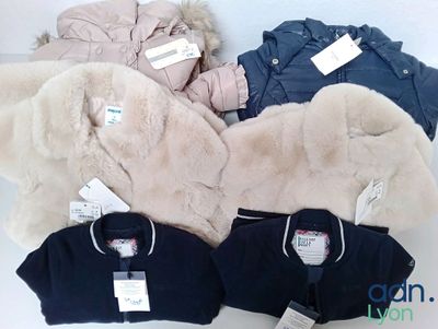 four jackets and two jackets with tags on them