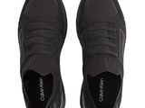 a pair of black sneakers on a white background