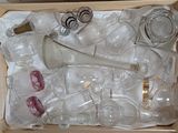 a box full of empty glassware on a table