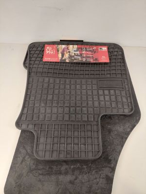 a pair of black rubber floor mats for a car
