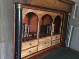a wooden desk with a book shelf on top of it