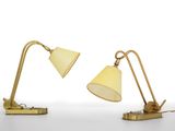 two lamps on a white surface with a white background