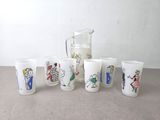 six cups with different designs on them on a table
