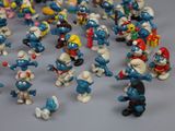 many small figurines of different sizes and colors