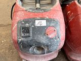 two red and black vacuums sitting next to each other