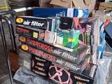 a cart full of boxes and other items on the floor
