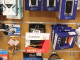 a display of cell phones on the wall in a store