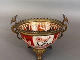 a red and white bowl sitting on a table