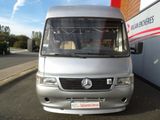 a silver van that is parked in front of a building