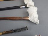 four different types of baseball bats on the table