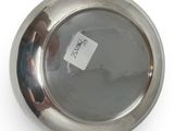 an image of a silver pocket watch with a tag on it