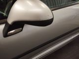a side view of a car with a mirror on the side of it