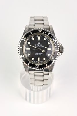 an image of a rolex watch with a black dial