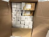 a cardboard box full of boxes and papers on the floor