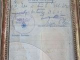 a picture of an old document in a gold frame