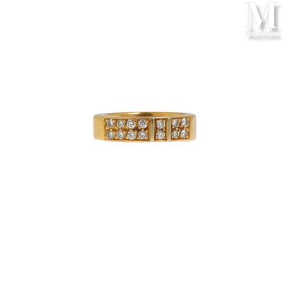 a close up of a gold ring with diamonds on a white background