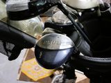 a close up of a motorcycle with a bag on the back