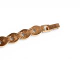 an image of a close up of a gold bracelet on a white background