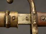 a close up of a sword with a metal handle