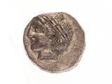 an old coin with a woman ' s head on it