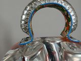 many cans of soda in a metal container