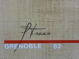 a sign that says grenoble 82 on the side of a building