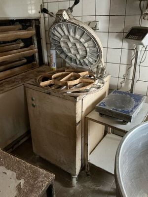 an image of a kitchen with a lot of tools on the counter