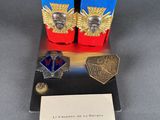 a pair of boots and a pair of medals on display