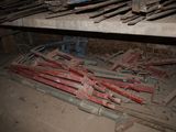 a pile of rusted pipes and pipes in a room