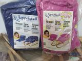 two bags of baby products sitting on a table