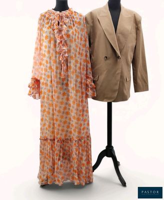 two dresses on a mannequin stand next to a suit on a mannequin